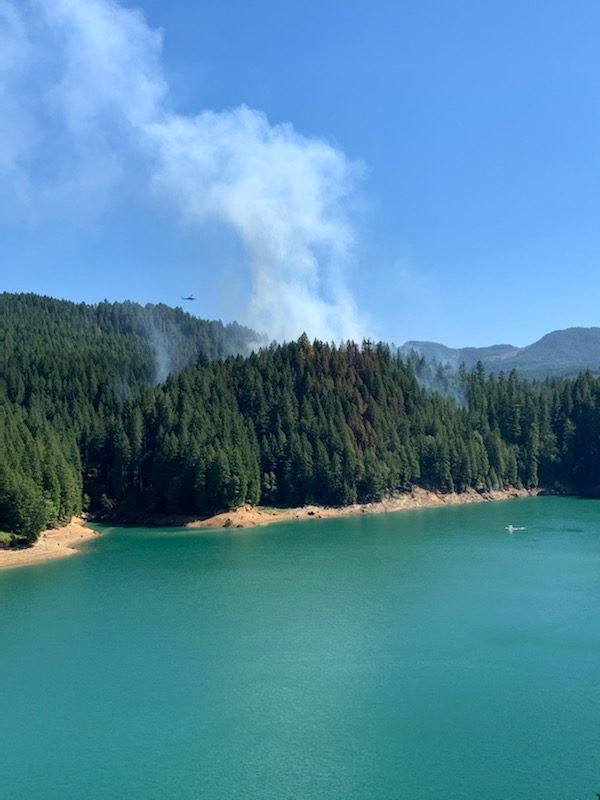 ODF firefighters use boats to reach a fire on a roadless peninsula at Green Peter Lake